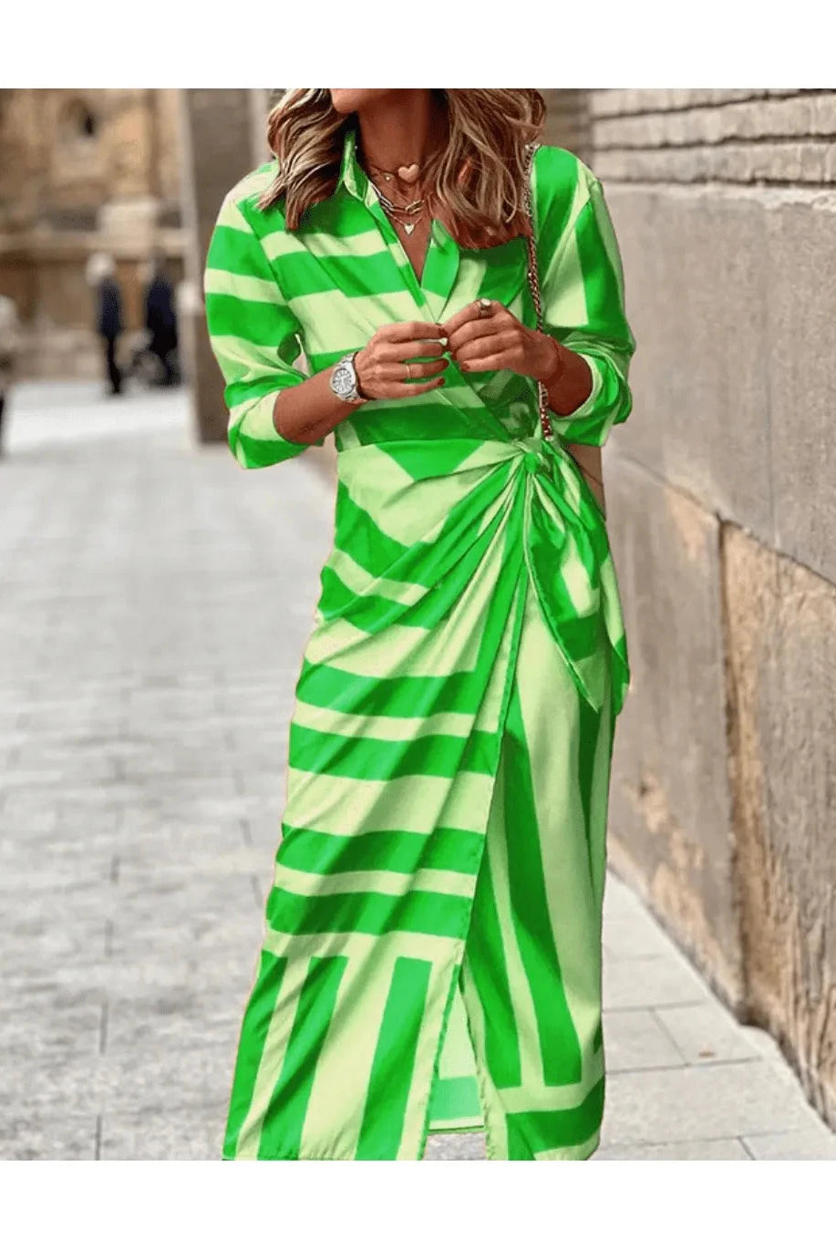 Lumina Wear Solana printed wrap dress in orange and pink, flowing fabric with a stylish design, perfect for casual or dressy occasions.