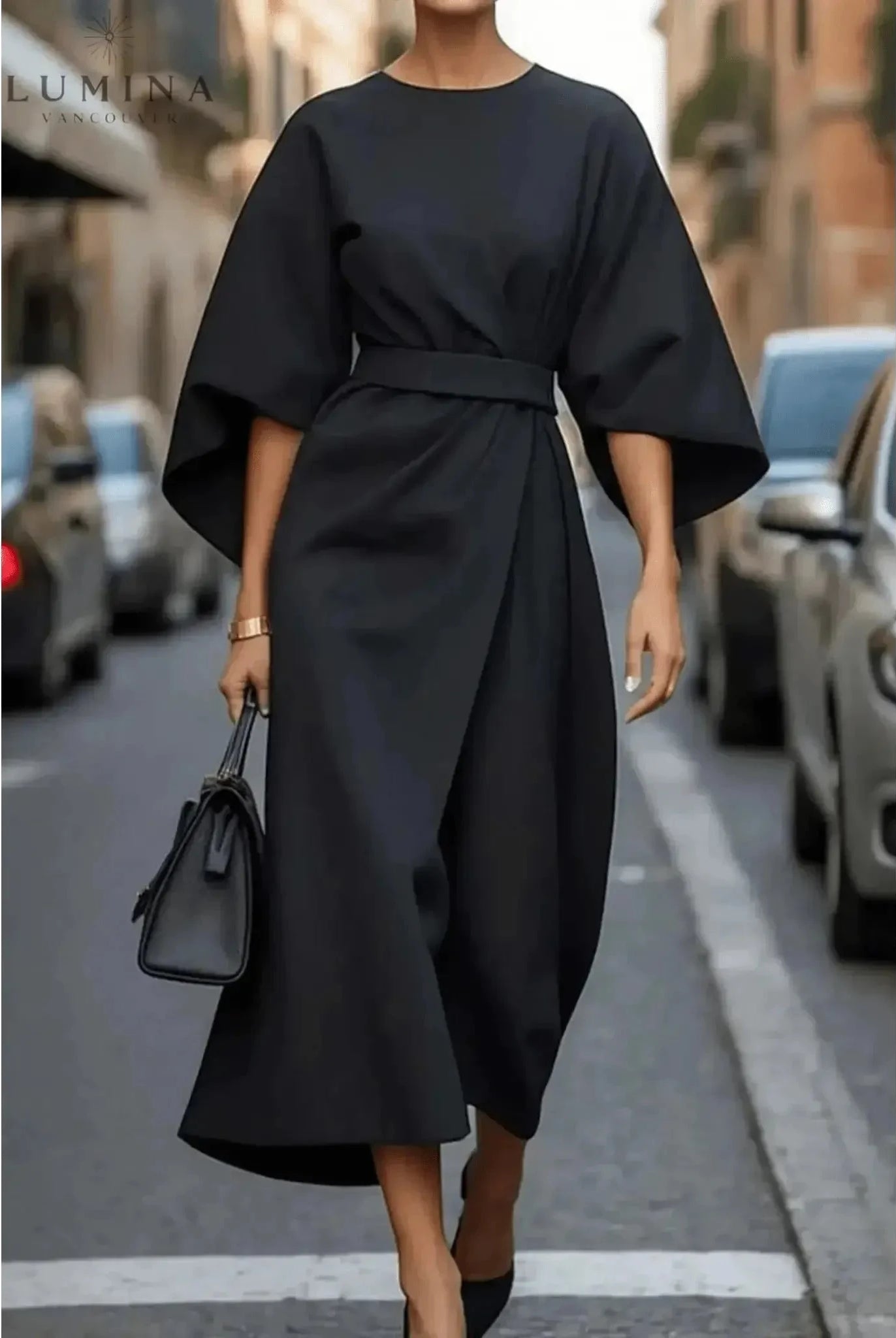 Navy blue Sonia elegant dress with belt by Lumina Wear, featuring a fitted waist and stylish design, on a model.