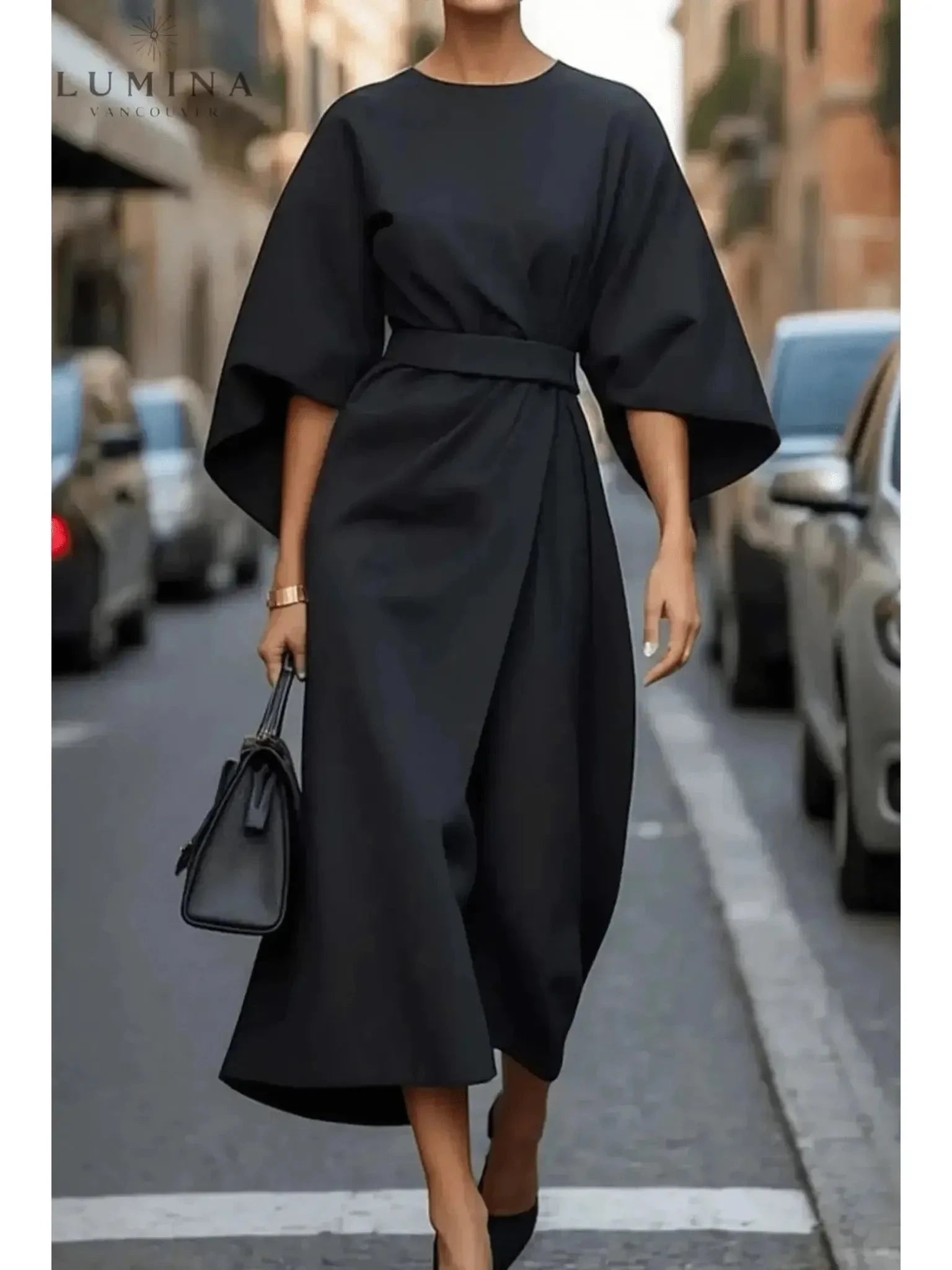 Navy blue Sonia elegant dress with belt by Lumina Vancouver, featuring a fitted silhouette and stylish waist detail.