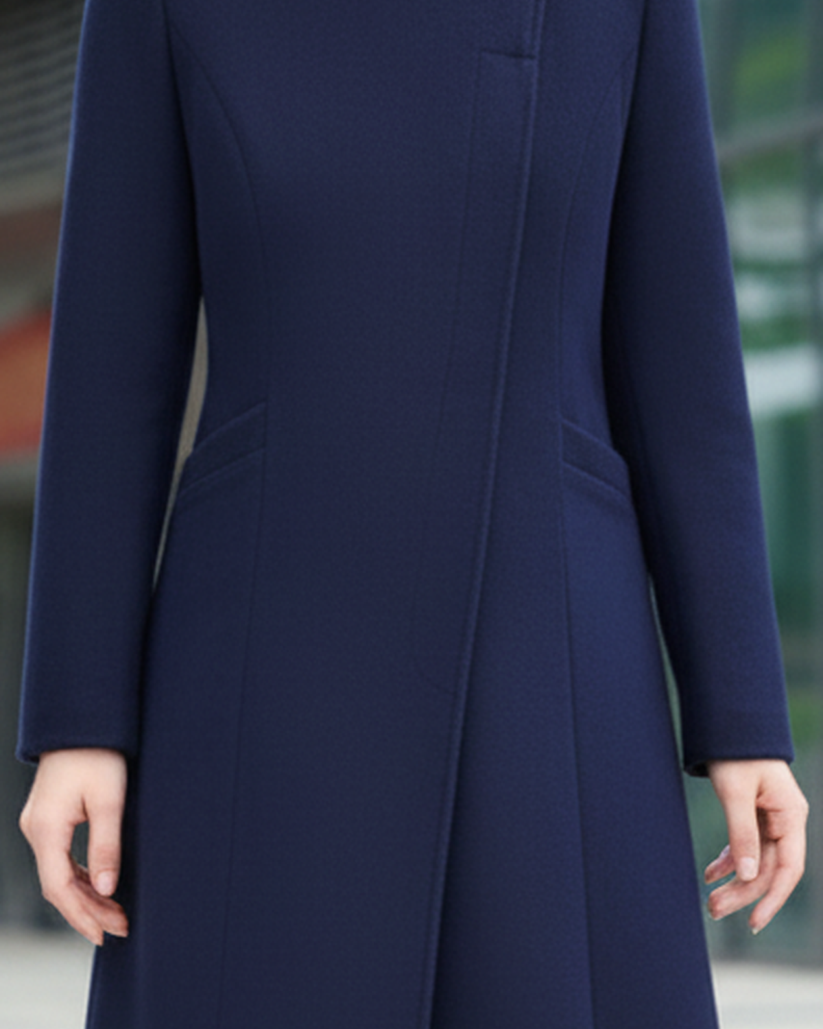 Navy blue Sophia Button Maxi Coat by Lumina Wear displayed on a model, showcasing its length and stylish design.