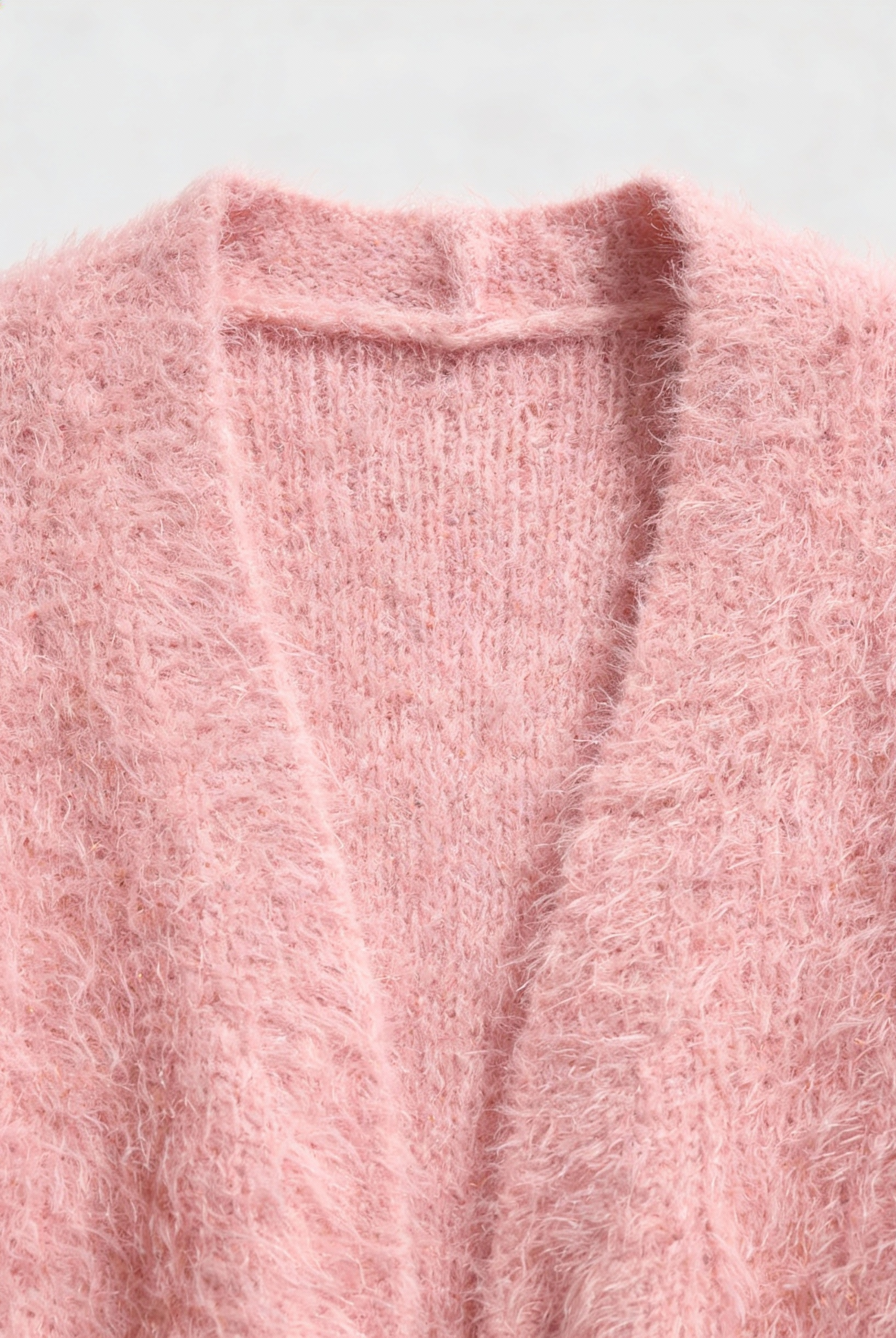 Pink knit cardigan from Lumina Wear's Sophia collection, cozy and versatile sweater featuring soft, stylish knit fabric.