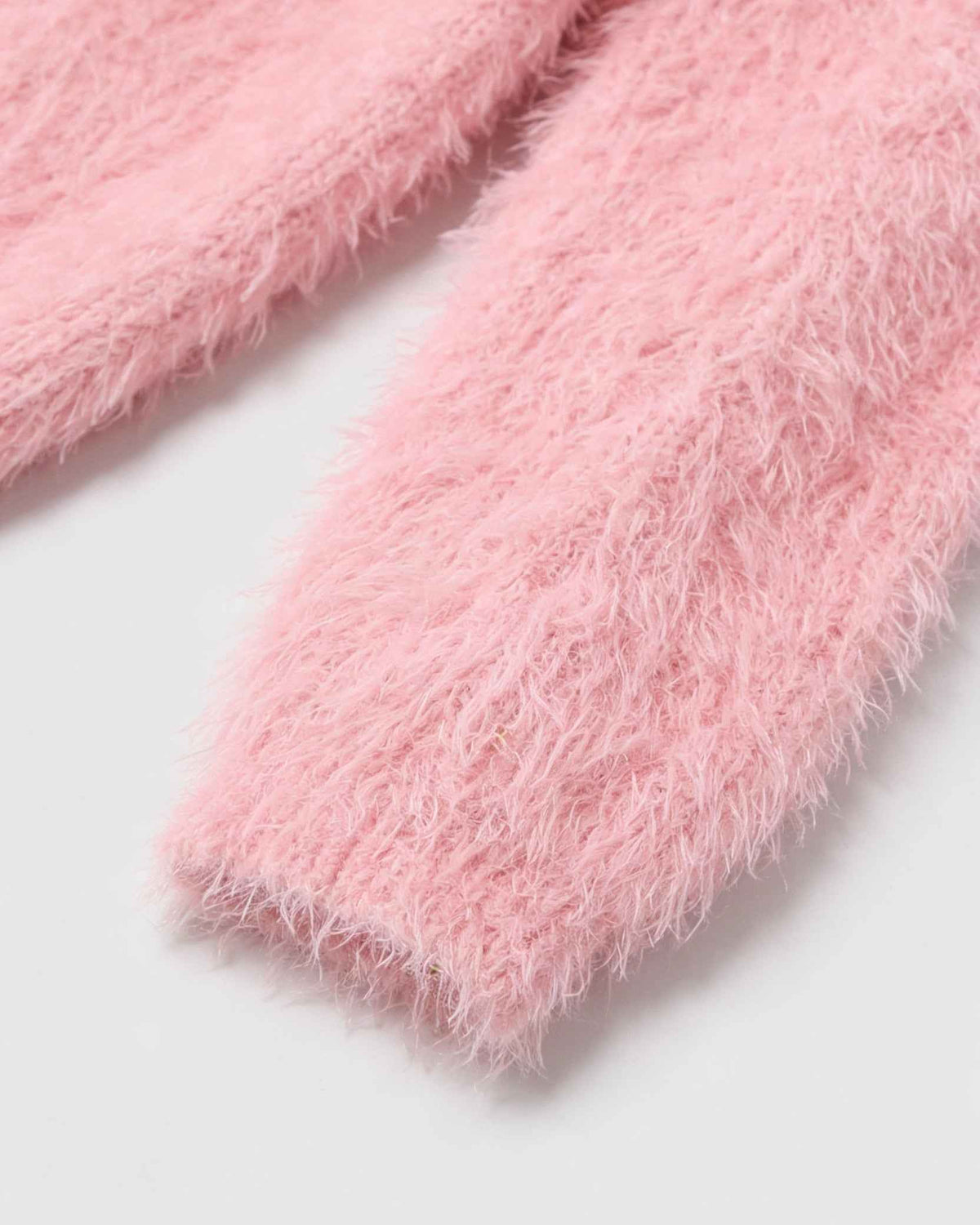 Pink knit cardigan by Lumina Wear featuring a cozy style, perfect for layering and versatile for casual or dressy outfits.