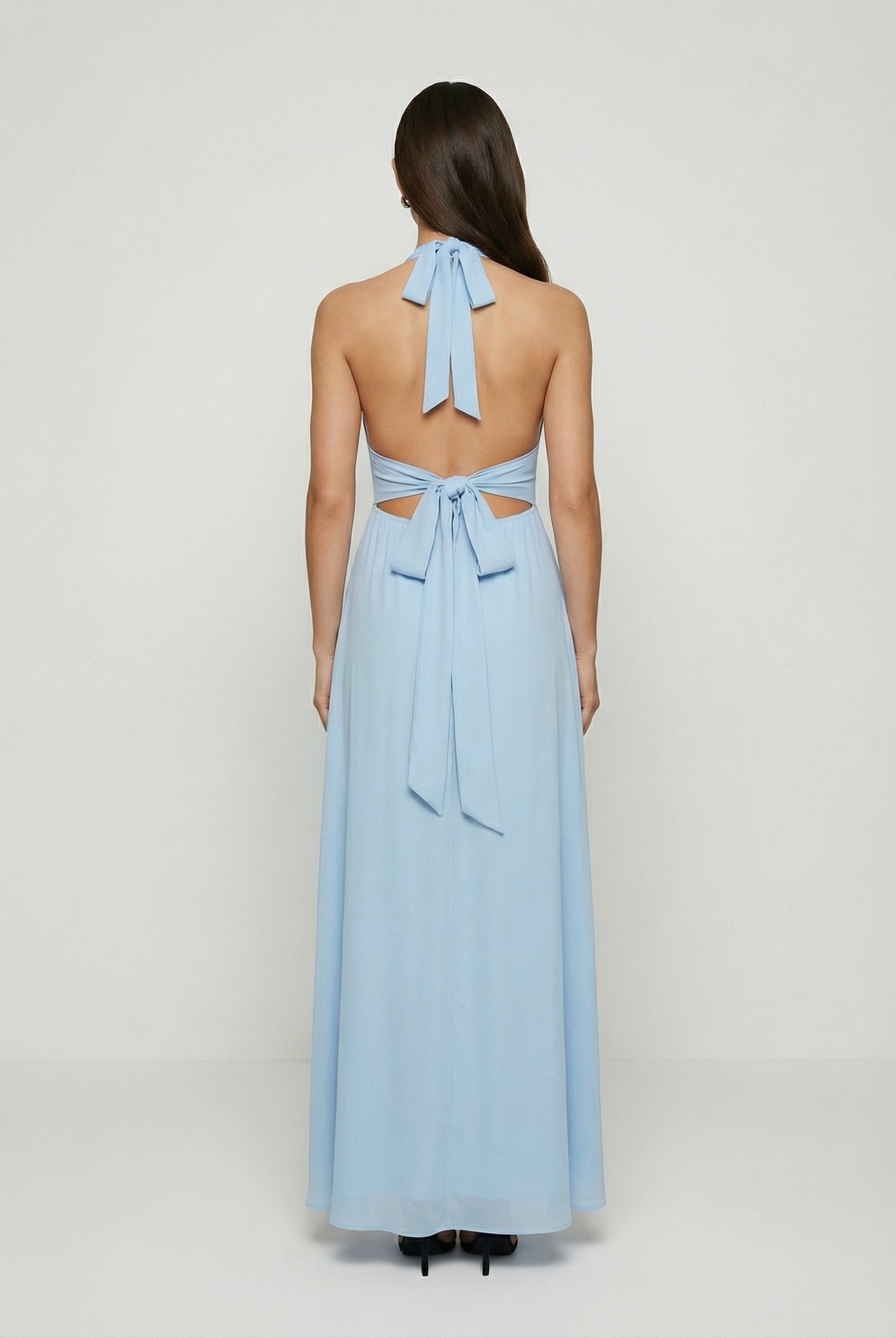 Elegant blue Sophia maxi dress by Lumina Wear featuring a backless design, flowing fabric, and sophisticated style.