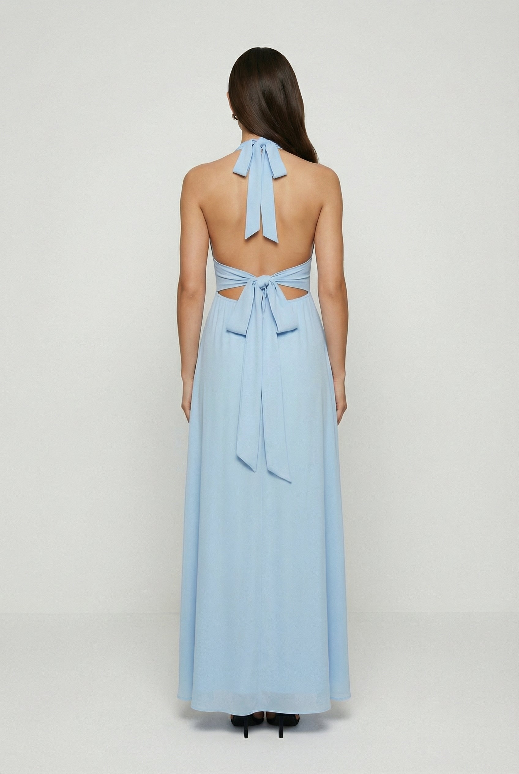 Elegant blue Sophia maxi dress by Lumina Wear featuring a backless design, flowing fabric, and sophisticated style.