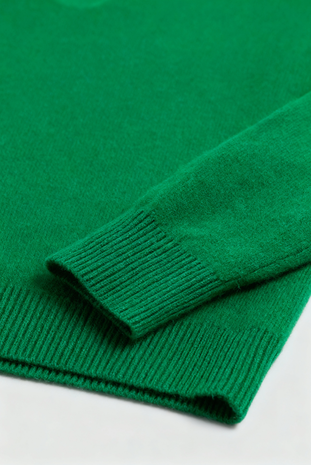 Elegant green Sophia V-neck sweater by Lumina Wear featuring a fitted silhouette, displayed on a neutral background.