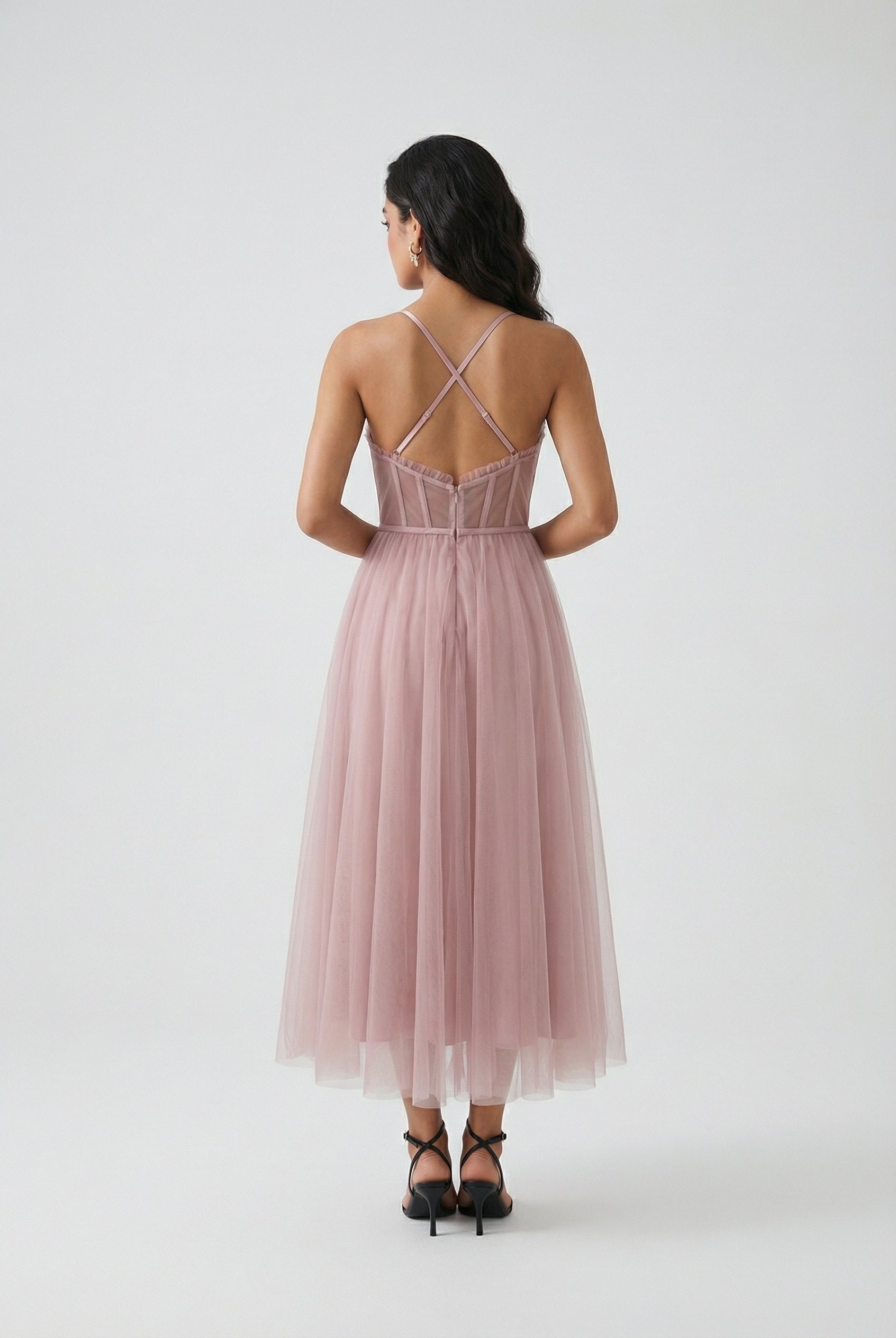 Elegant pink midi dress by Lumina Wear featuring a flattering silhouette, perfect for sophisticated occasions.