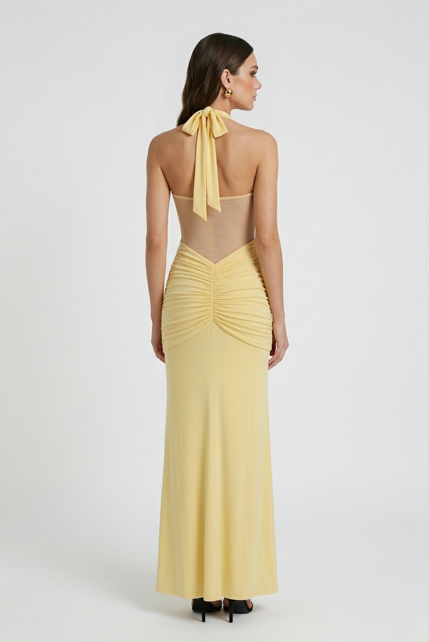 Elegant yellow halter dress with ruched detail from Lumina Wear, featuring a fitted style and stylish design.