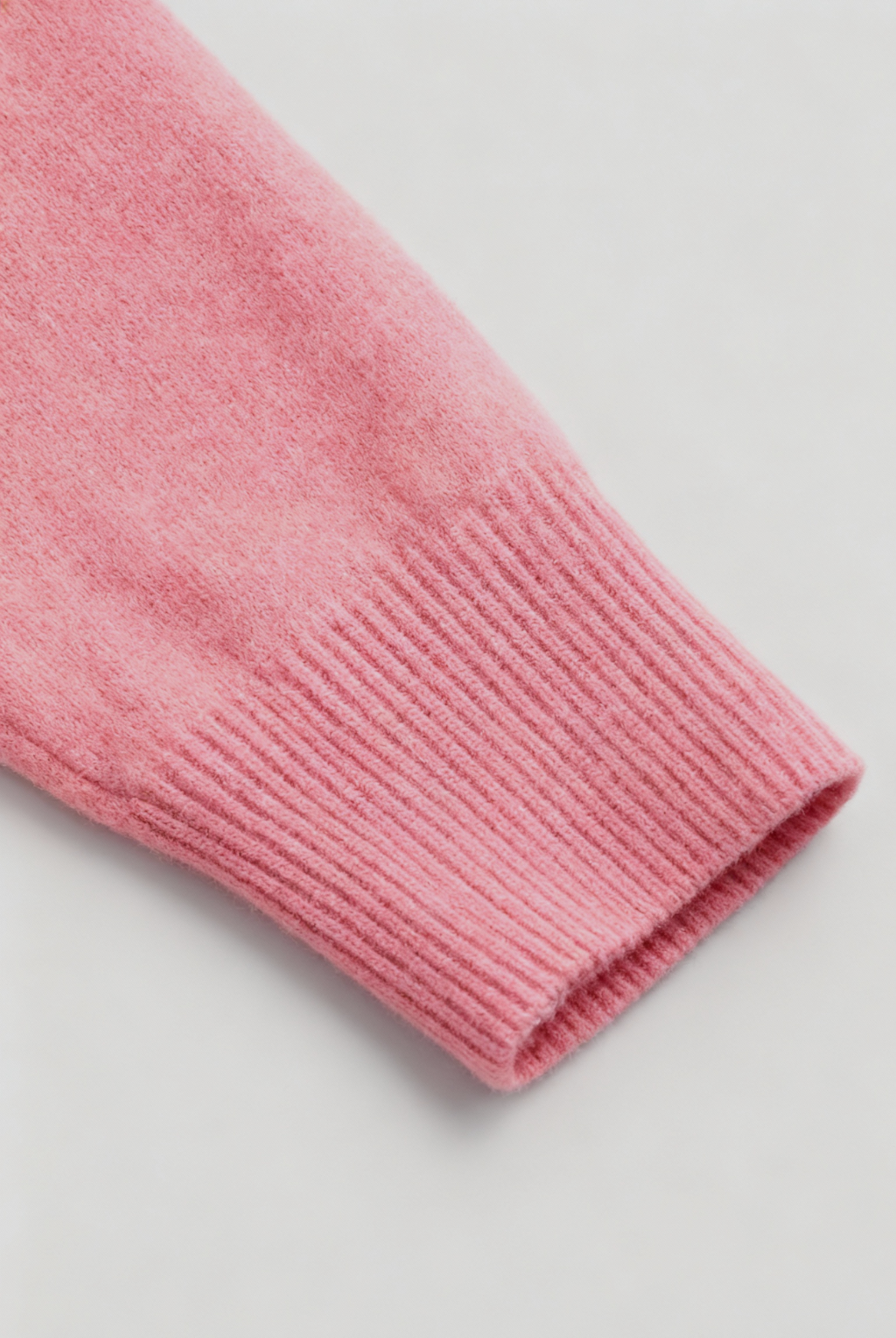 Pink Lumina Wear Sophia V-neck knit sweater with long sleeves, featuring a flattering design and cozy knit texture.