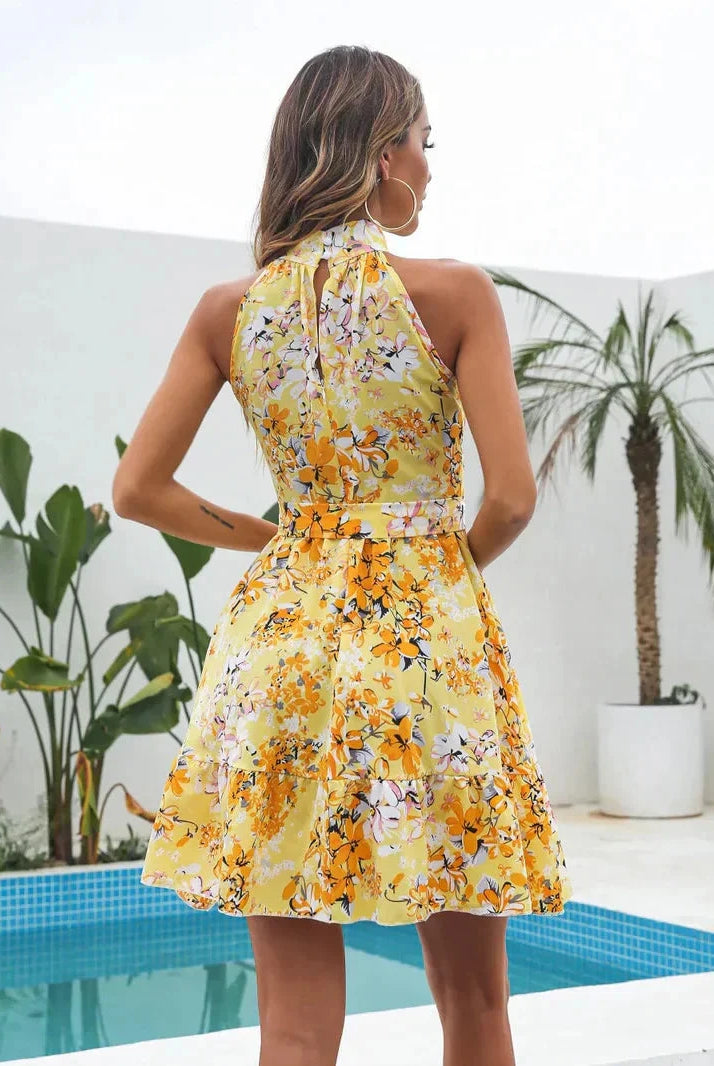 Pink floral Amandine halter neck mini dress by Lumina Wear, featuring a fitted silhouette and stylish design.