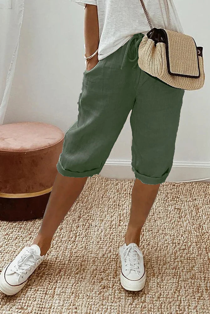Black Sophia Lumina Wear lightweight breathable cotton shorts with elastic waist, shown on a model.