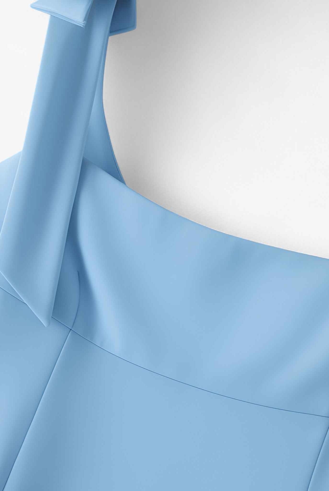 Lumina Wear Sophia playful bow-detail crop top with zipper closure in blue, designed for women, shown in XS size.