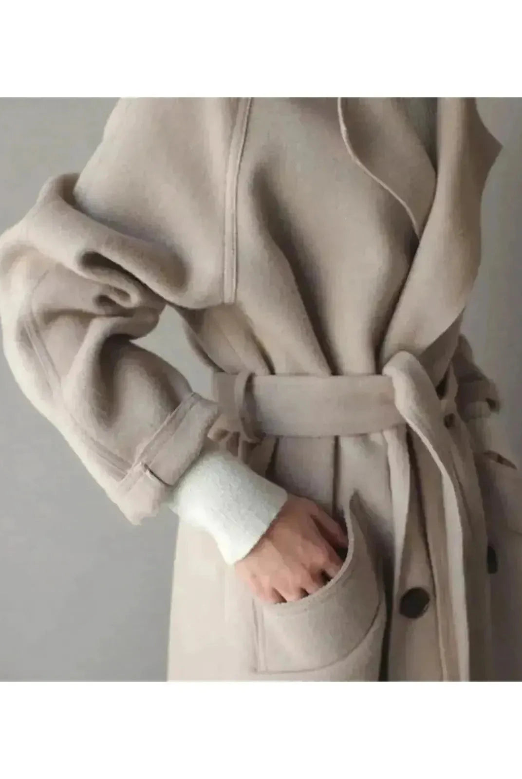 Beige Sophie long coat for women by Lumina Vancouver, featuring a tailored, elegant design with a classic collar and button closure.