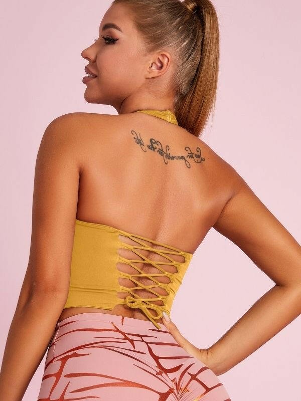 Black Lumina Vancouver sports bra with Roman knot halter design and beautify back detail, ideal for active wear.
