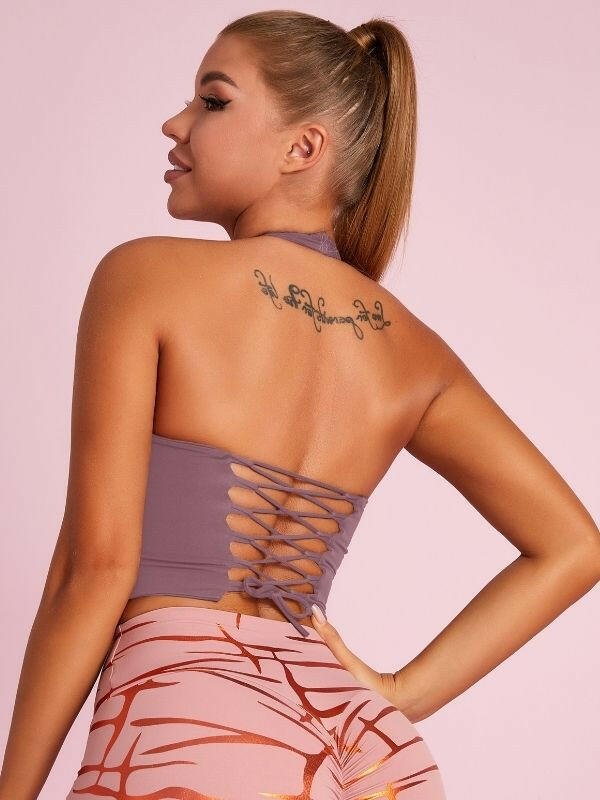 Black Lumina Vancouver sports bra with Roman knot halter design and beautify back detailing, ideal for active wear.