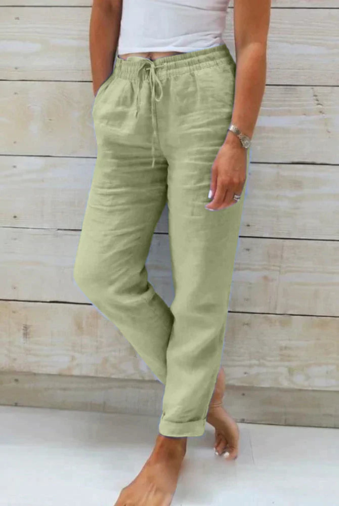 Light beige linen trousers for women by Lumina Wear, modern fit Stacy lightweight linen pants, shown in green XS size.