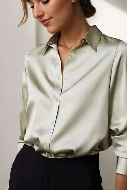 Green satin Stella blouse by Lumina Wear featuring a classic button-down design, elegant and stylish for sophisticated looks.