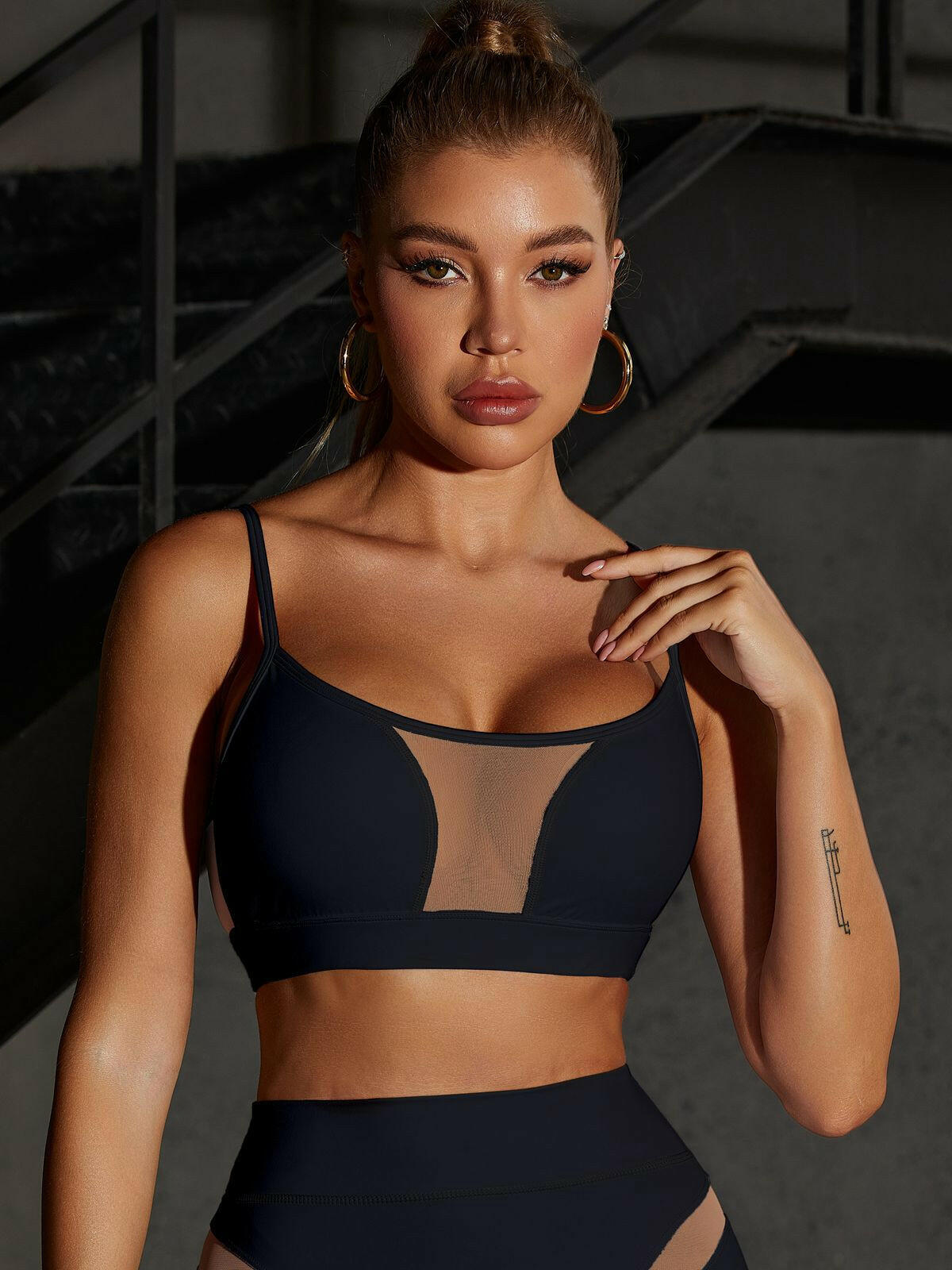 Black Lumina Vancouver mesh sports bra featuring a sexy, unique design with breathable fabric and supportive fit.