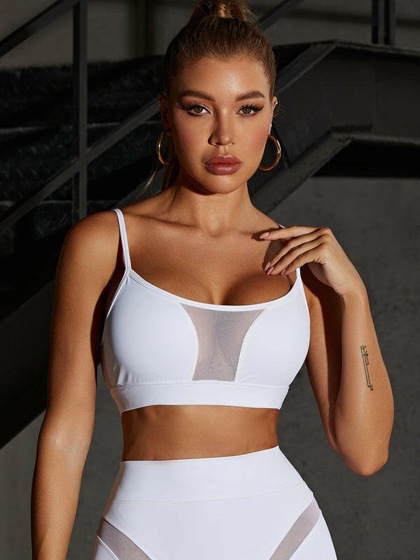 White Lumina Vancouver mesh sports bra with a sleek, sexy design and unique mesh details for active wear and stylish support.