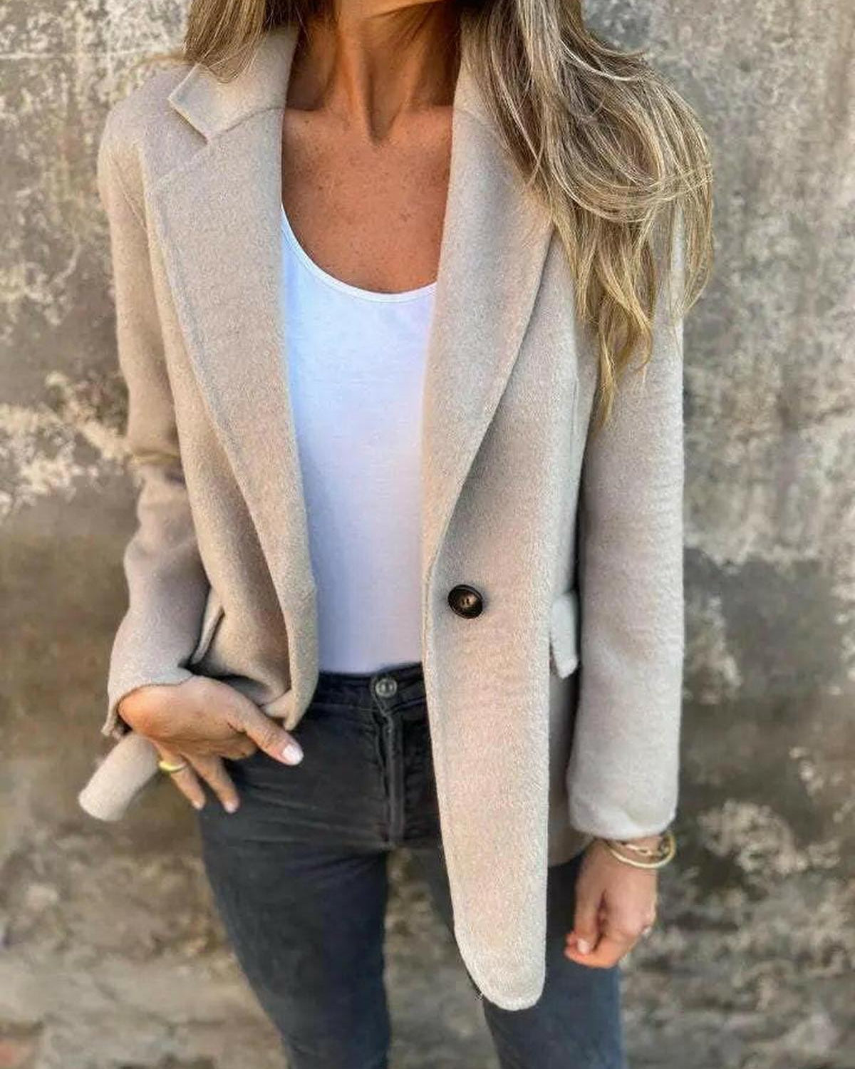 Suzanne Lumina Wear casual blazer in apricot color, tailored fit with lapel collar and front buttons, displayed on a hanger.