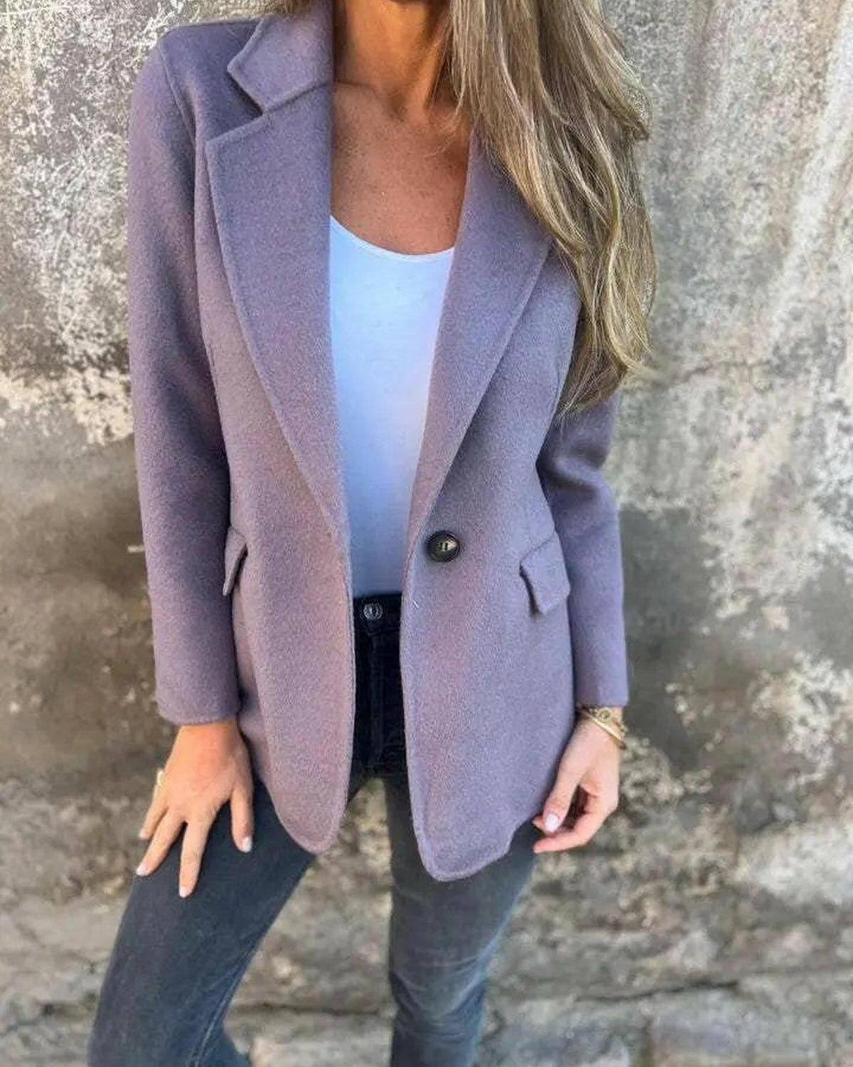 Suzanne casual blazer by Lumina Wear in apricot, displayed on a hanger, showcasing its tailored fit and stylish collar.
