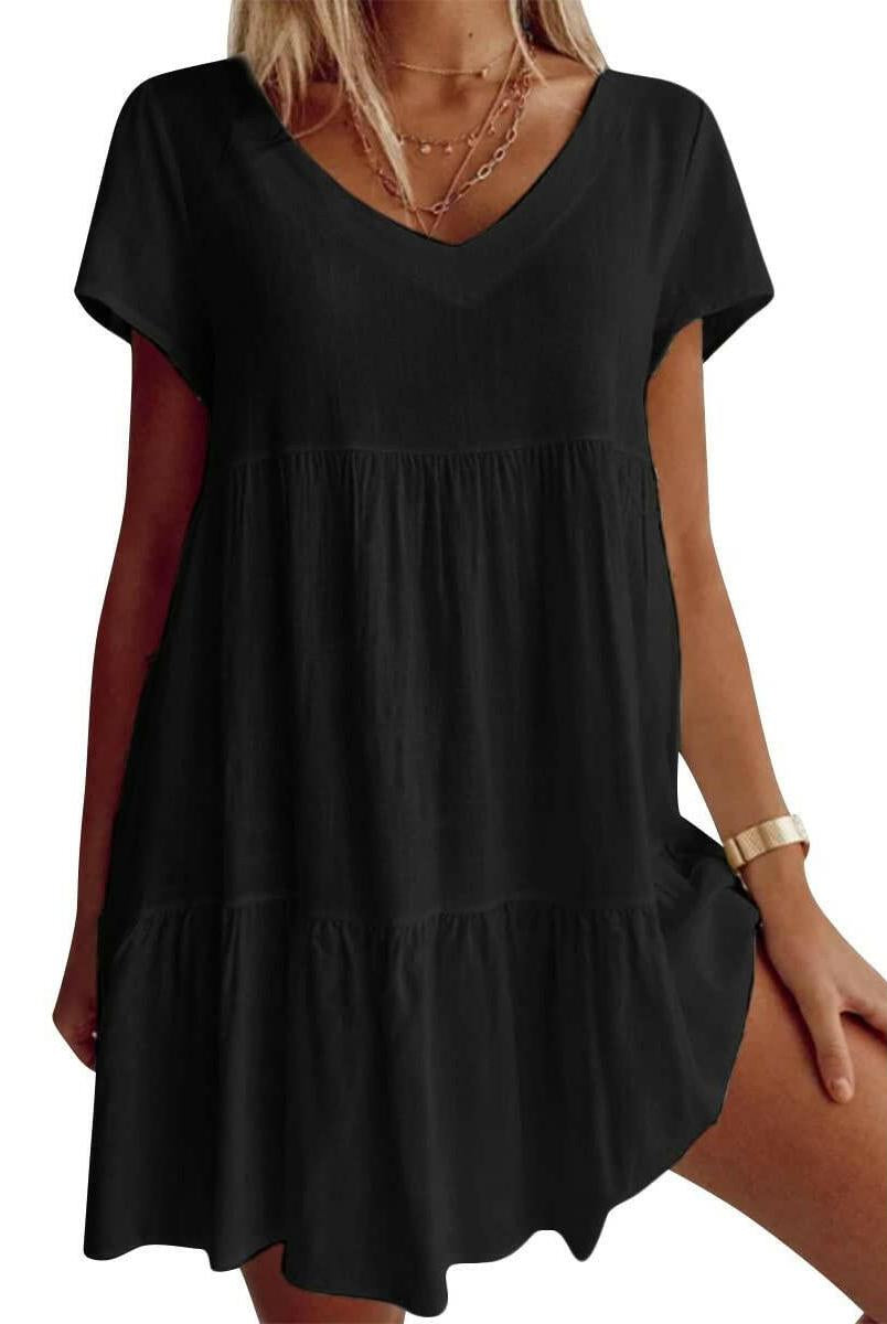 White Suzy Breezy V-Neck Dress by Lumina Vancouver, lightweight and stylish for warm weather, shown on a hanger.