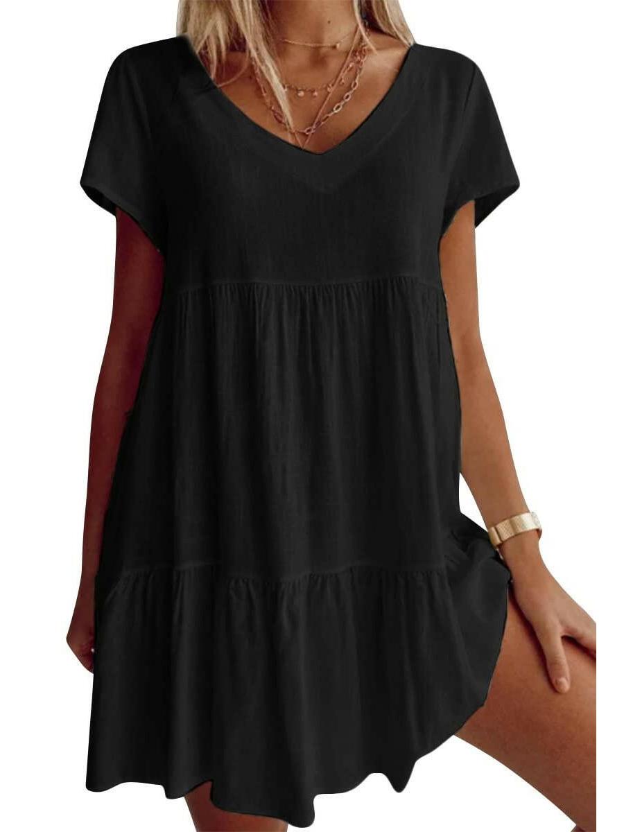 White Suzy Breezy V-Neck Dress by Lumina Vancouver, lightweight and stylish for warm weather, shown on a hanger.