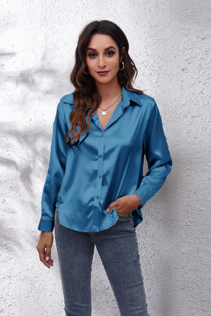 Light blue Lumina Wear Sydney relaxed fit satin blouse for women, showcasing elegant design and soft fabric.