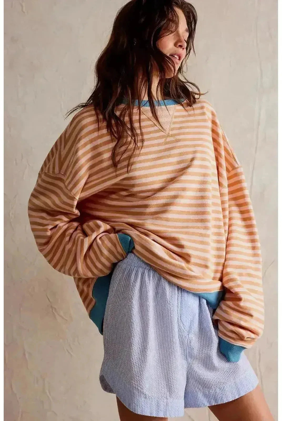 Sky-blue Tāme oversized fall sweater by Lumina Wear, featuring a cozy, relaxed fit and soft knit fabric.