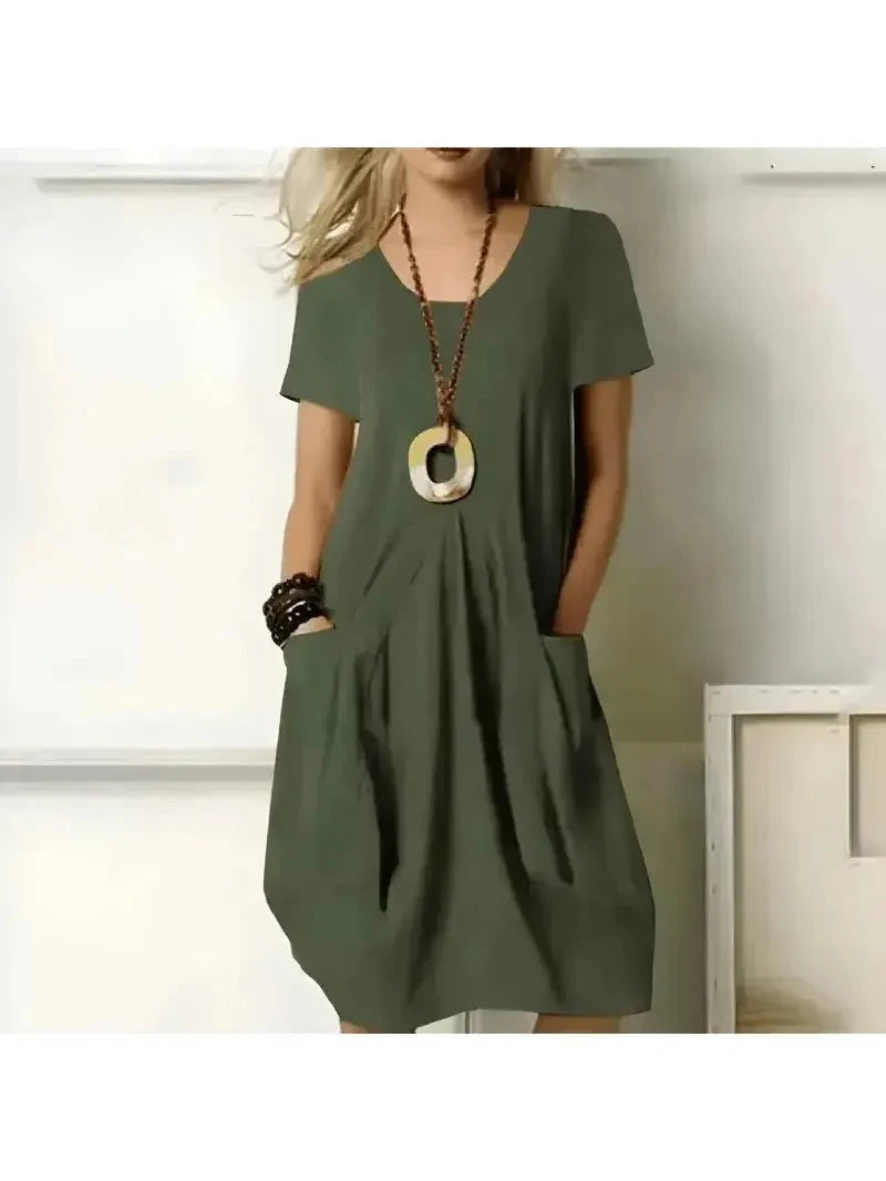 Lumina Vancouver Tia stylish green one-color dress with flattering tummy coverage, perfect for casual or semi-formal wear.
