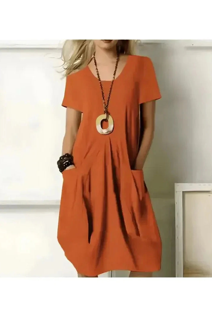 Green Tia dress by Lumina Wear, stylish one-color dress with flattering tummy coverage, perfect for casual or dressy occasions.