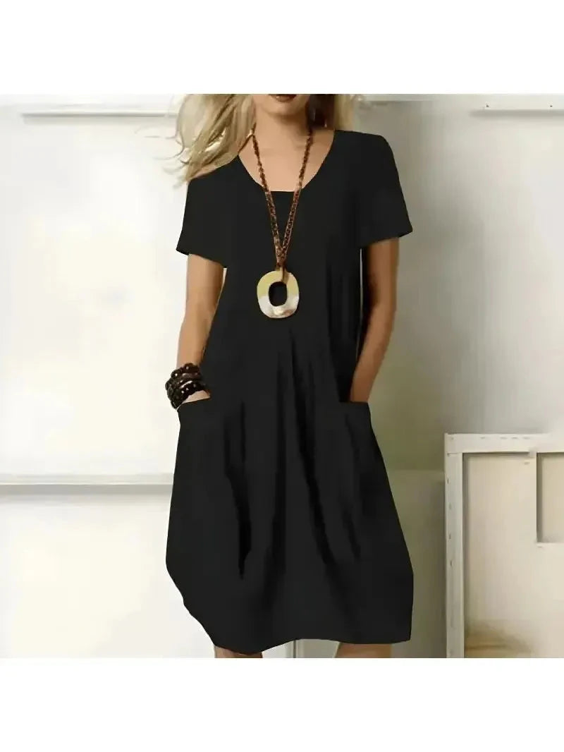 Green Tia dress by Lumina Vancouver, stylish one-color dress with flattering tummy coverage and elegant fit.