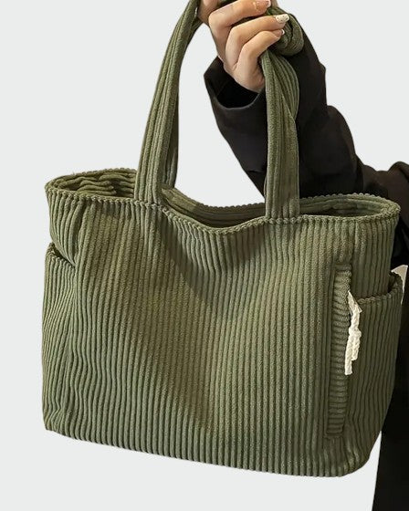 Lumina Wear Tilda minimalist tote bag in green, showing its spacious interior and sleek handbag design.