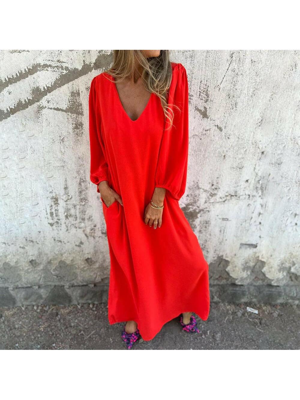 Red-orange Trixy™ Maxi Dress by Lumina Vancouver, flowing fabric and elegant design, perfect for summer occasions.