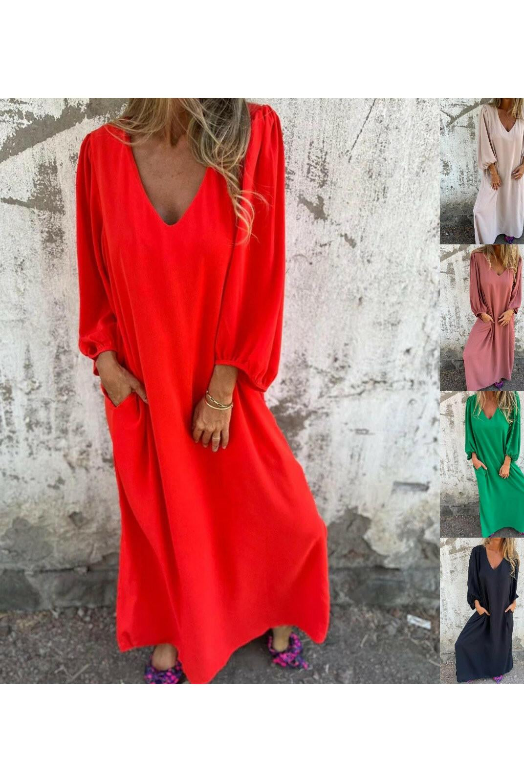 Red-orange Lumina Wear Trixy Maxi Dress displayed on a model, flowing fabric, stylish silhouette, perfect for summer occasions.