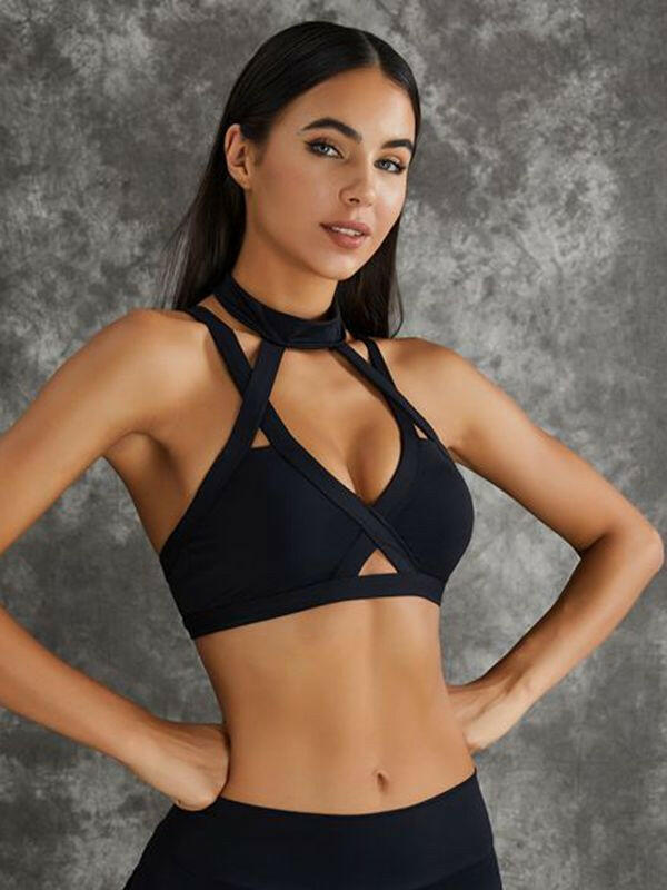 Black Lumina Vancouver sports bra with unique cut-out design, showcasing breathable fabric and supportive fit for active wear.