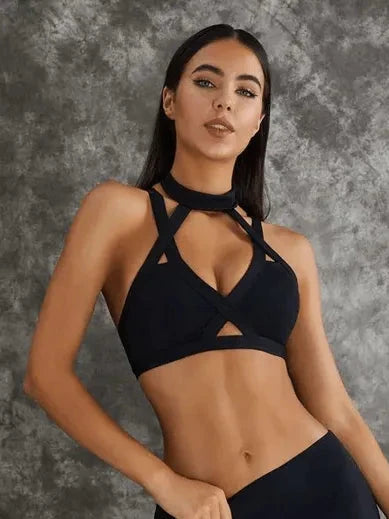 Dark sea green Lumina Vancouver sports bras with unique cut-out design, shown in a bundle of multiple bras.