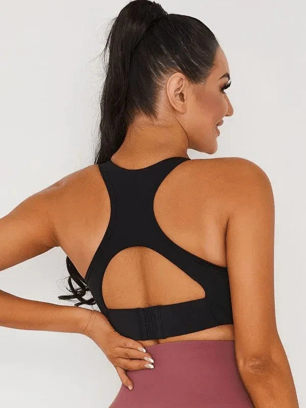Black Lumina Vancouver V-neck sports bra with a stylish open back and supportive fit, designed for active wear.
