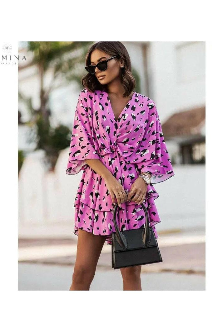 Lumina Vancouver Valeria bohemian floral mini summer dress in orange and pink, featuring a relaxed fit and lightweight fabric.