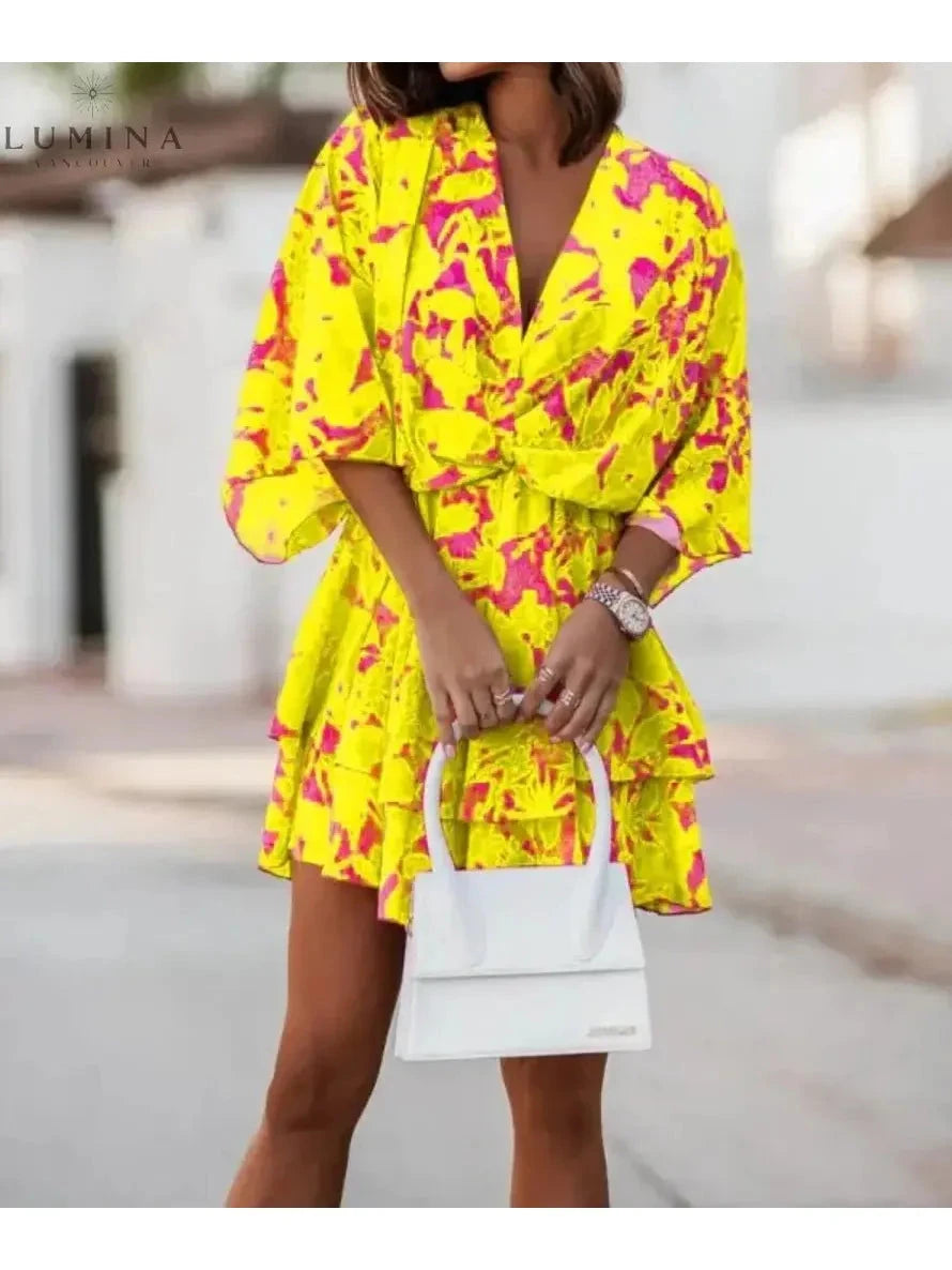 Valeria Bohemian Floral Mini Dress by Lumina Vancouver featuring orange and pink floral patterns, sleeveless summer dress for women.