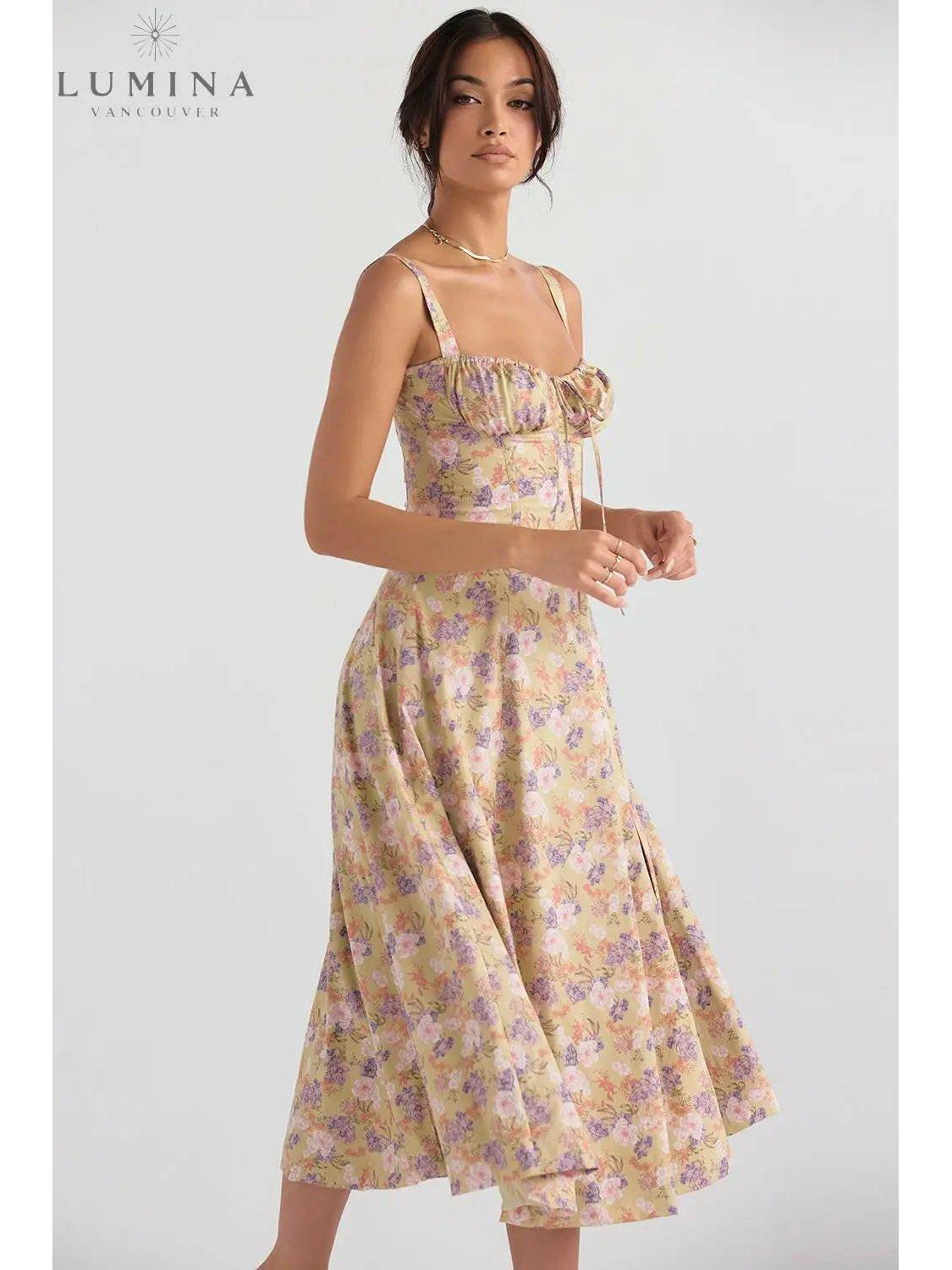 White Venura spring wedding guest dress by Lumina Vancouver featuring a floral print, perfect for spring and summer occasions.