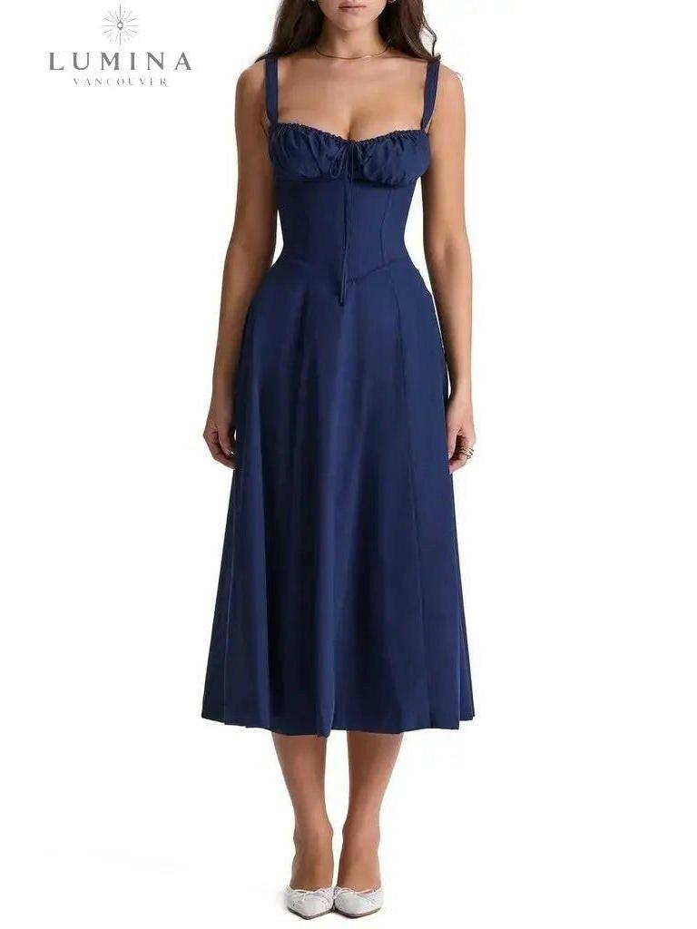 White Venura spring dress with floral print, perfect for wedding guests, by Lumina Vancouver.