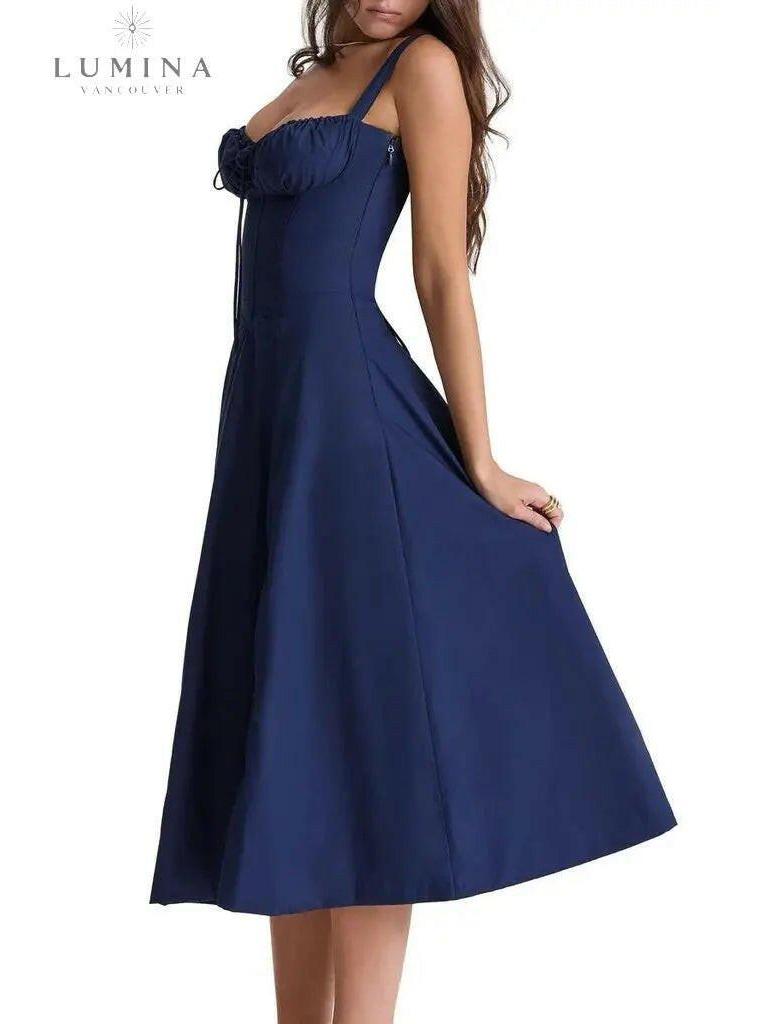 White Venura spring wedding guest dress by Lumina Vancouver featuring a floral print, perfect for elegant occasions.