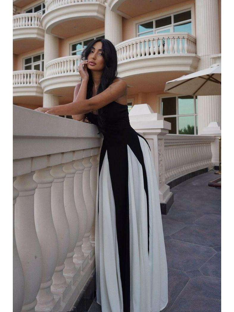 Black and white Viara maxi dress by Lumina Vancouver featuring a paneled design and flowing silhouette.