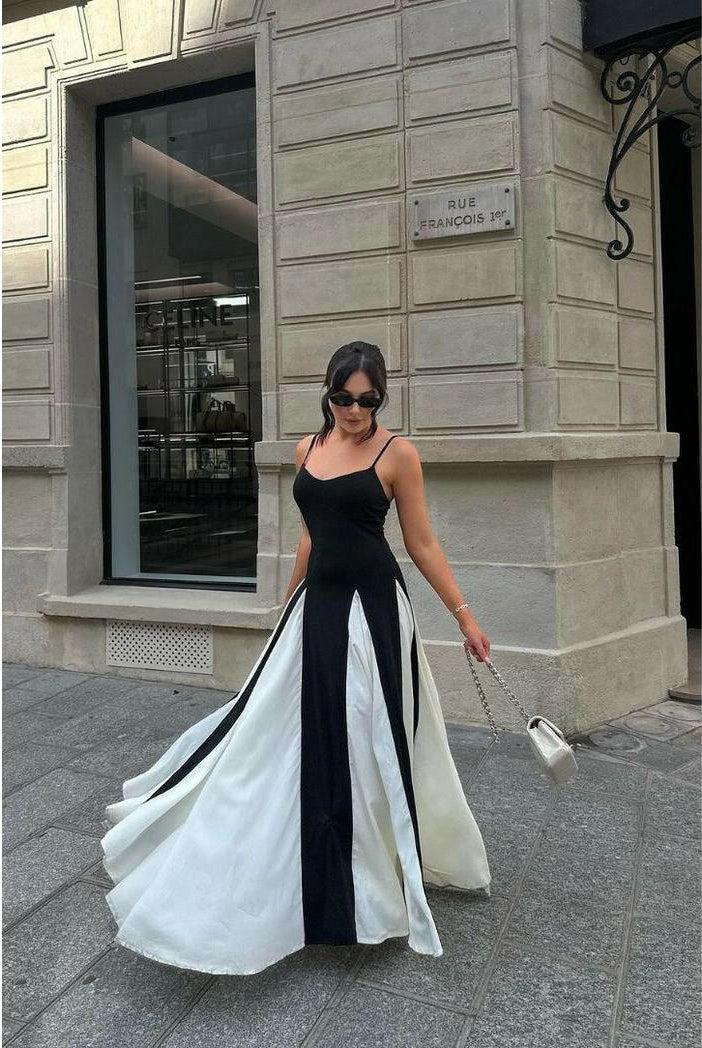 Lumina Wear Viara paneled maxi dress in black and white, flowing design with long sleeves and elegant silhouette.