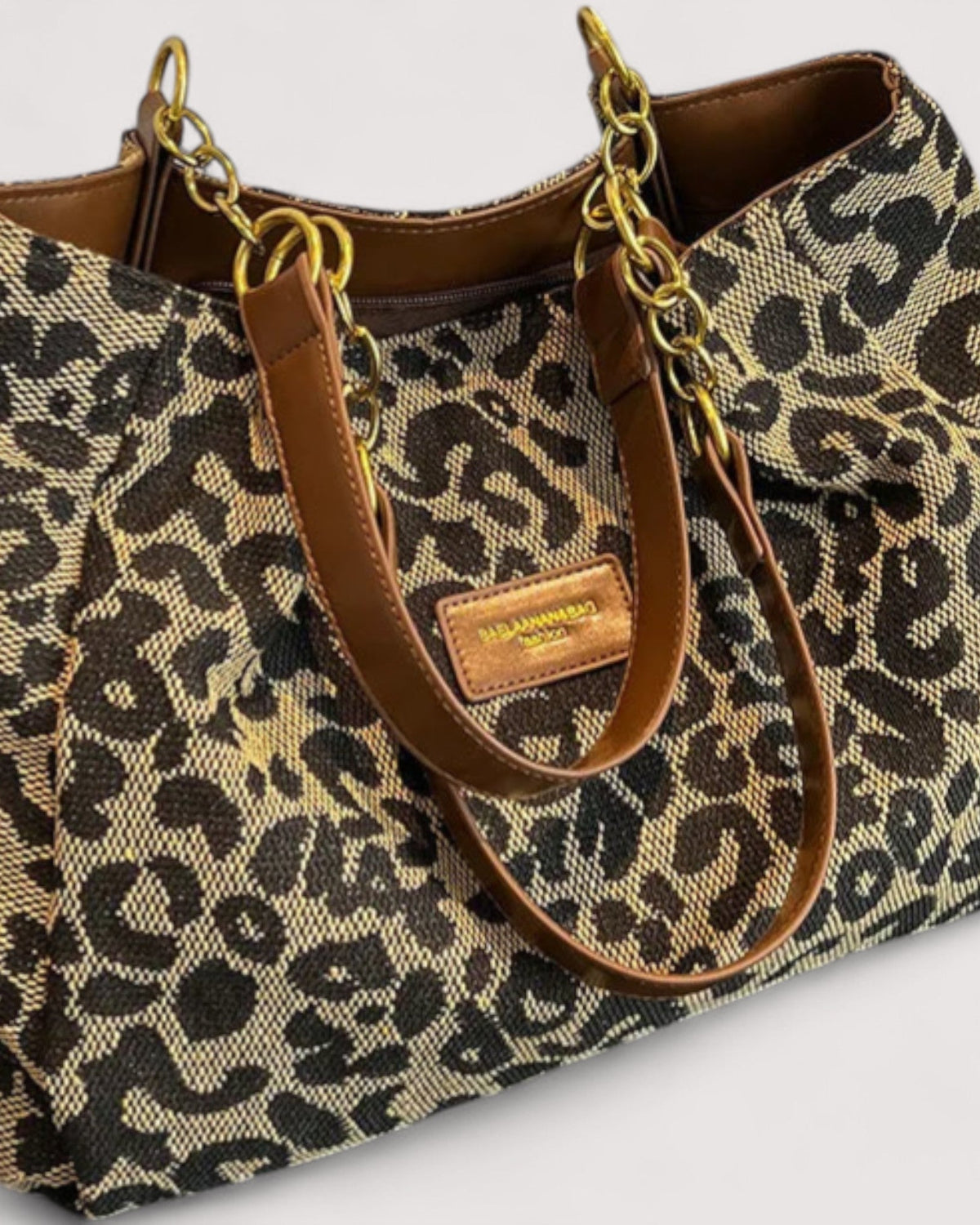 Victoria leopard print canvas shopping bag by Lumina Wear, stylish handbag with bold animal print and sturdy handles.