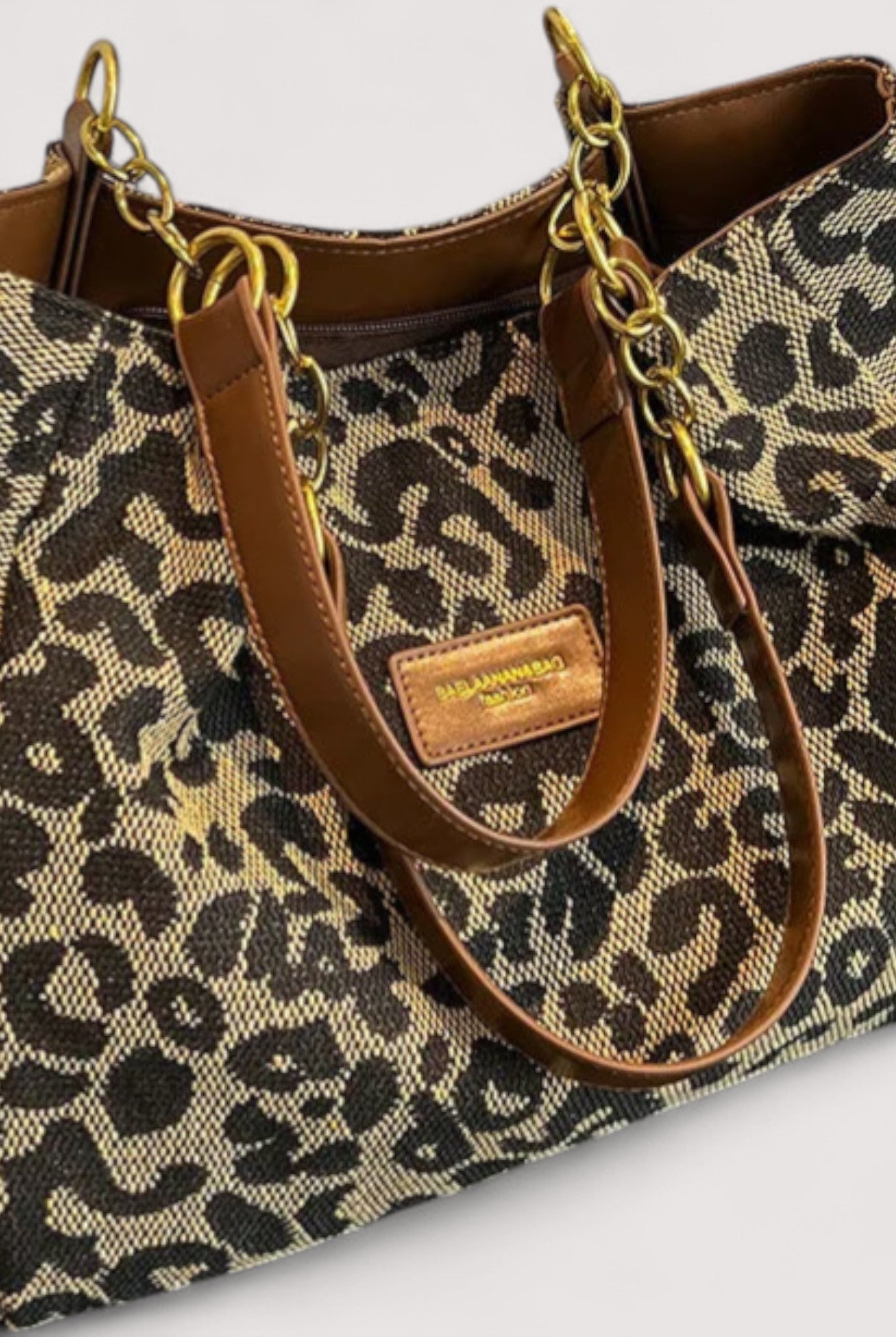 Victoria bold leopard print canvas shopping bag by Lumina Wear, stylish and spacious handbag with a vibrant animal pattern.