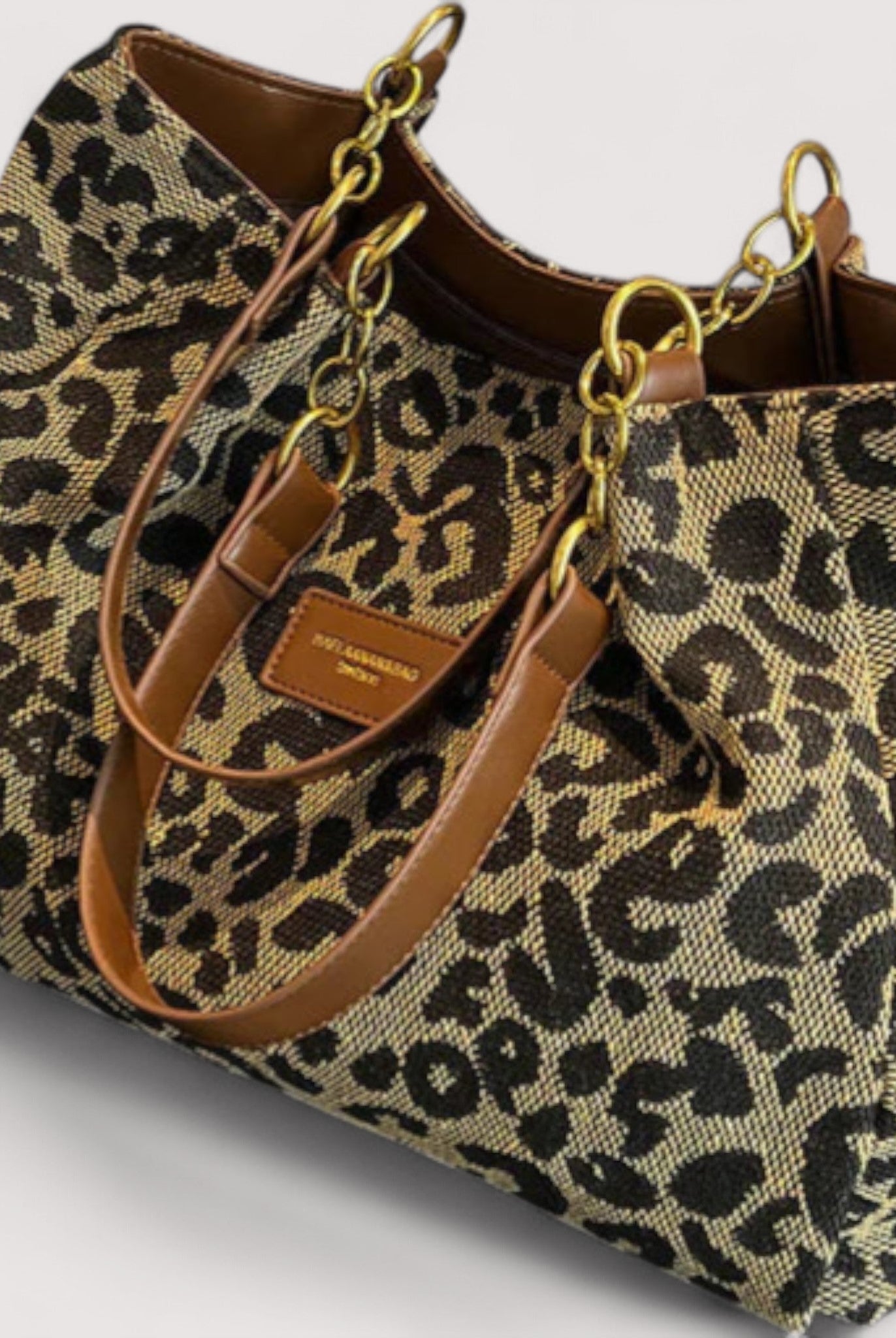 Victoria bold leopard print canvas shopping bag by Lumina Wear, featuring spacious design and sturdy handles.