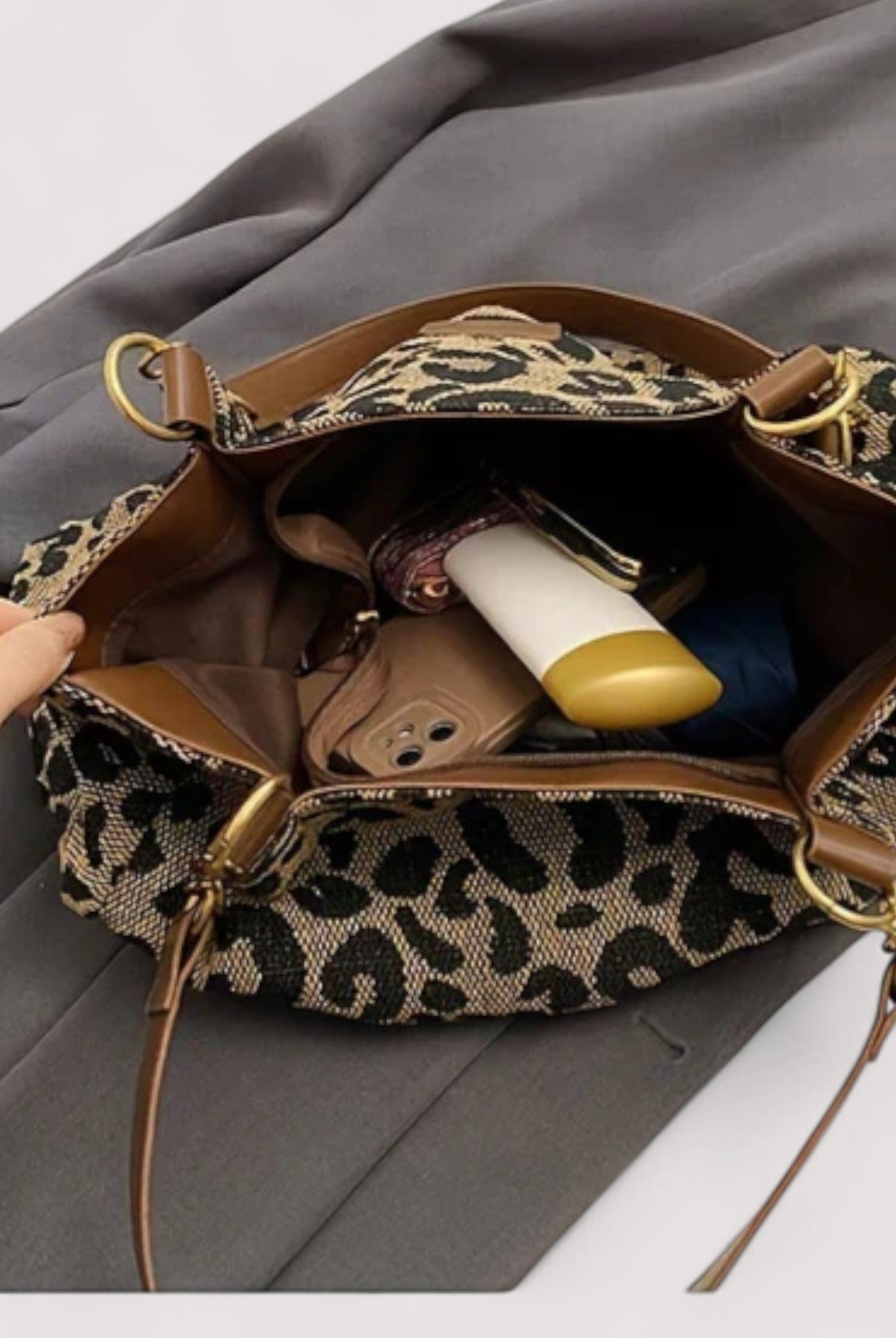 Lumina Wear Victoria leopard print canvas shopping bag with sturdy handles and bold animal pattern for fashionable everyday use.