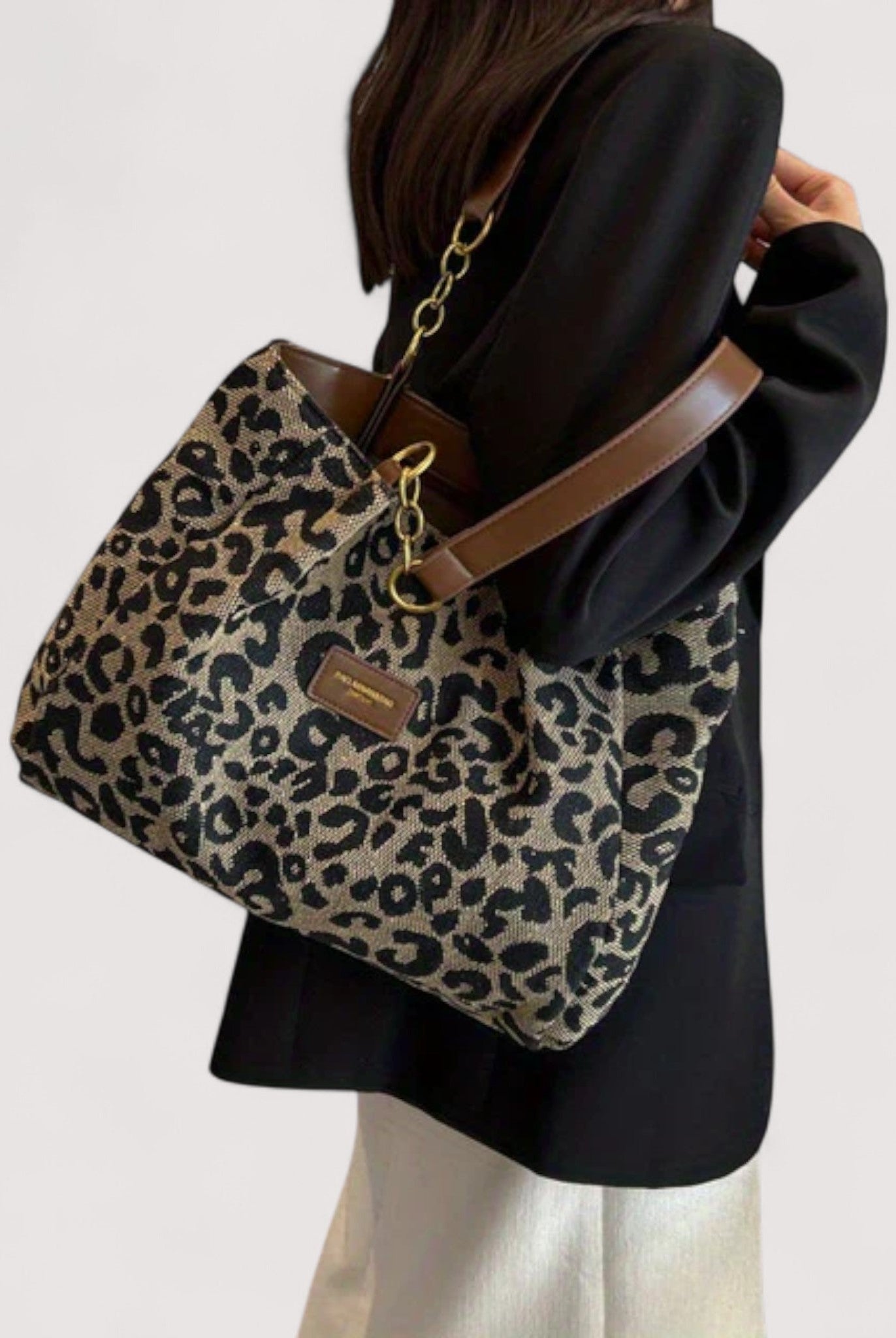 Victoria bold leopard print canvas shopping bag by Lumina Wear, showcasing a spacious tote with sturdy handles and vibrant animal pattern.