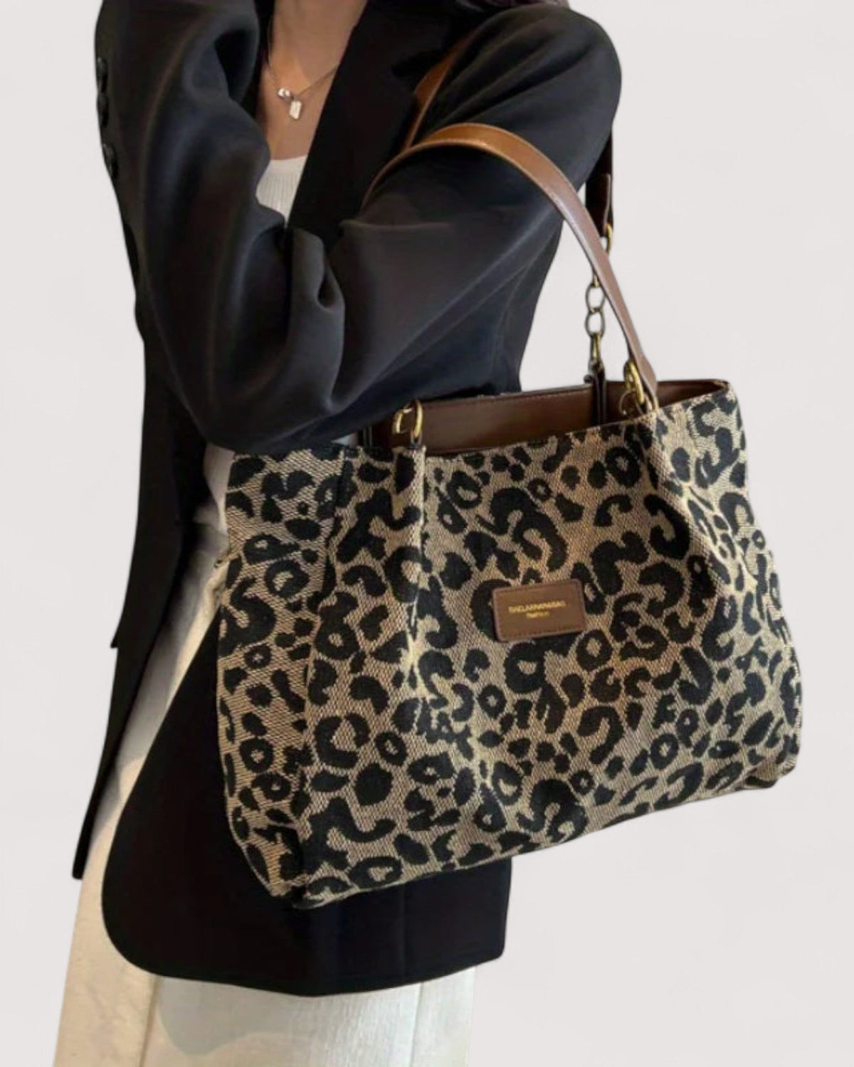 Victoria Leopard Print Canvas Handbag by Lumina Wear featuring bold leopard pattern and sturdy canvas material.